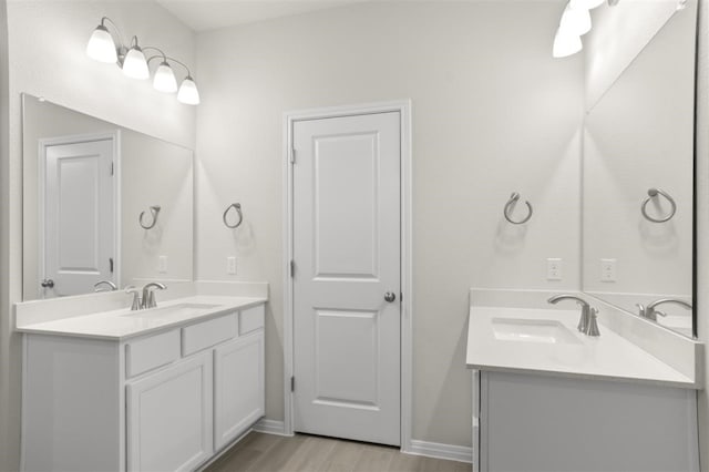 bathroom with hardwood / wood-style flooring and vanity