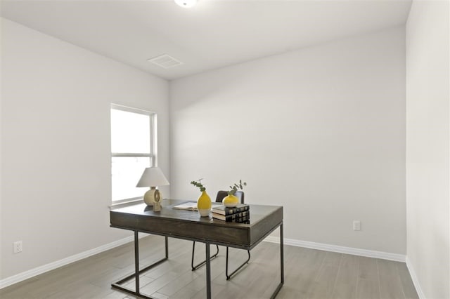 home office with light wood-type flooring