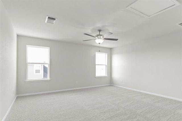 empty room with light colored carpet and ceiling fan