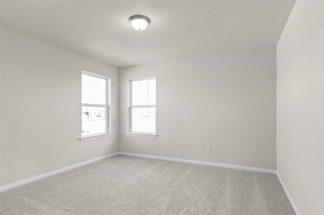 unfurnished room with carpet floors