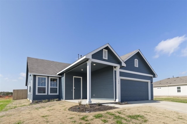 308 Yellowstone Dr, Kyle, TX 78640 - view of front of house with a garage, fence, and driveway