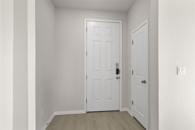 308 Yellowstone Dr, Kyle, TX 78640 - doorway featuring baseboards and light wood-type flooring