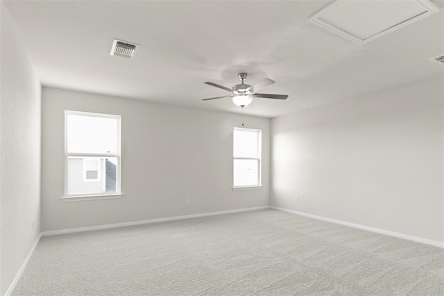 308 Yellowstone Dr, Kyle, TX 78640 - unfurnished room with visible vents, attic access, baseboards, and light colored carpet