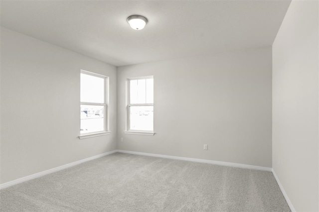 308 Yellowstone Dr, Kyle, TX 78640 - unfurnished room with baseboards and light colored carpet