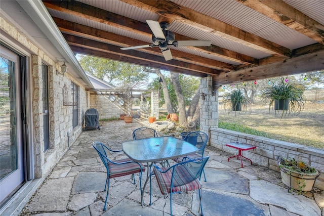 view of patio featuring ceiling fan