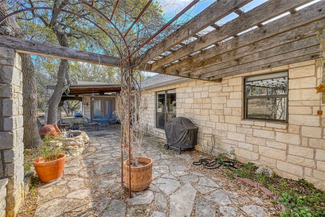 view of patio with a grill