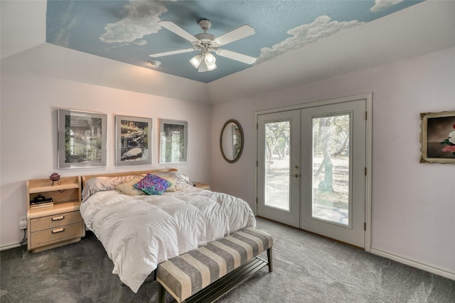 bedroom featuring french doors, carpet, access to outside, ceiling fan, and a tray ceiling