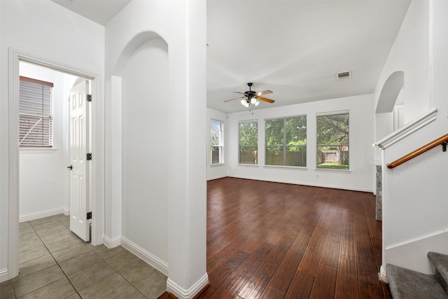 interior space with ceiling fan and tile patterned flooring