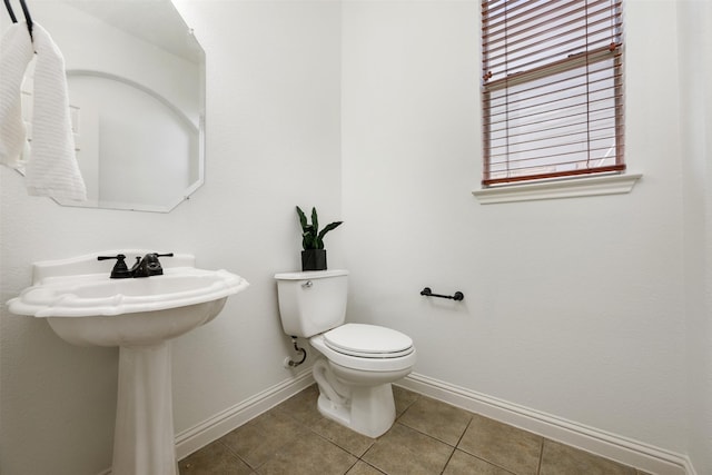 bathroom with tile patterned floors and toilet