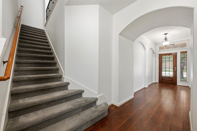 foyer entrance with dark hardwood / wood-style flooring