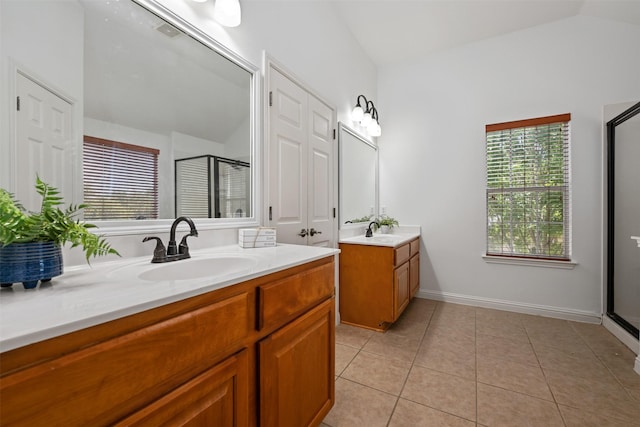 bathroom featuring a shower with shower door, tile patterned floors, lofted ceiling, and vanity