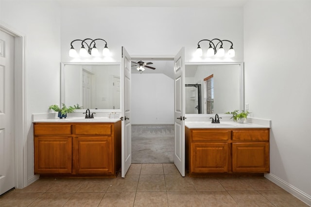 bathroom with vanity, ceiling fan, tile patterned floors, and an enclosed shower