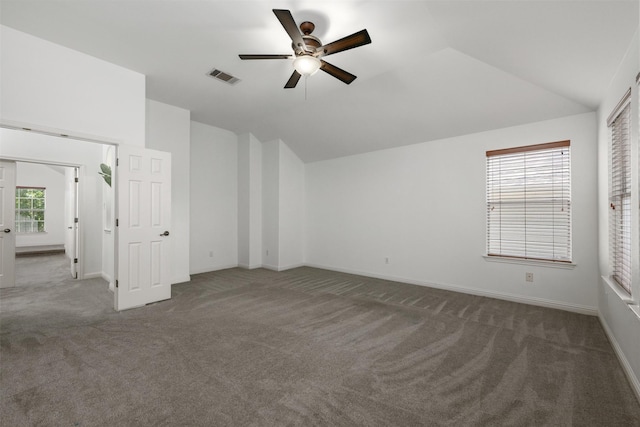 interior space featuring ceiling fan, carpet flooring, and vaulted ceiling