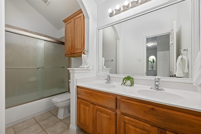 full bathroom with toilet, enclosed tub / shower combo, tile patterned flooring, vanity, and lofted ceiling