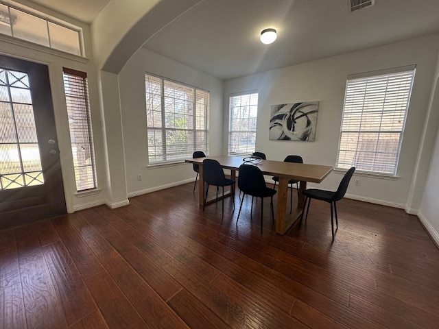 dining space featuring dark hardwood / wood-style flooring