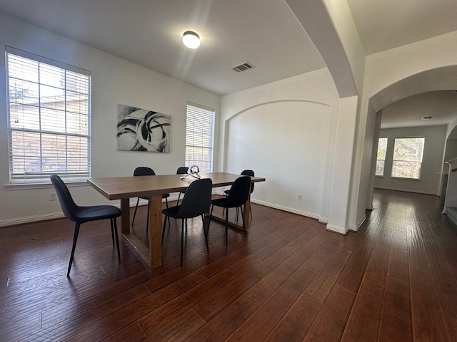 dining area with dark hardwood / wood-style floors