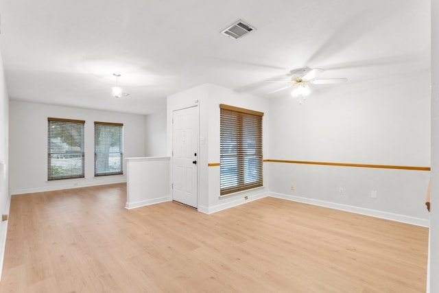 unfurnished room with ceiling fan and light hardwood / wood-style flooring