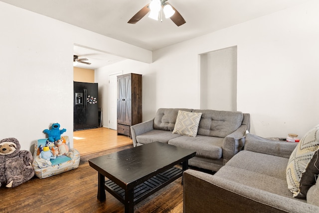 living room with ceiling fan and hardwood / wood-style floors