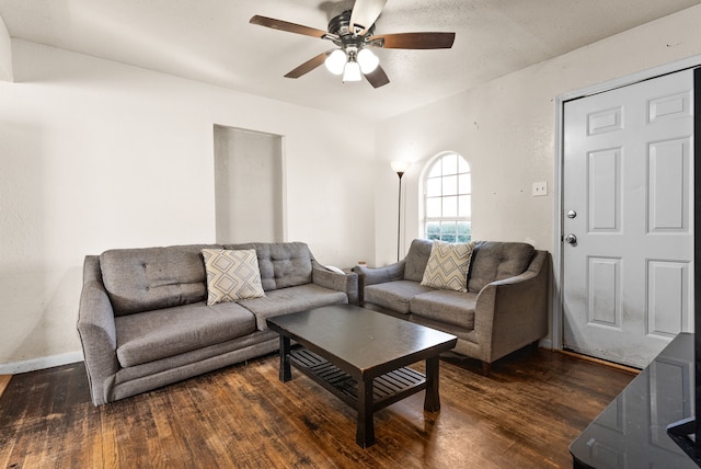 living room with ceiling fan and dark hardwood / wood-style floors