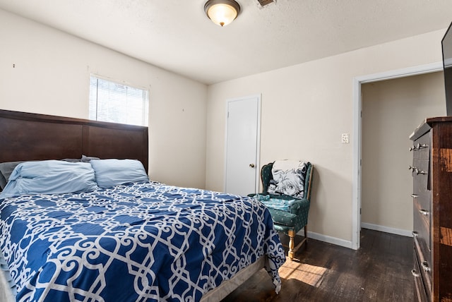 bedroom featuring dark wood-type flooring