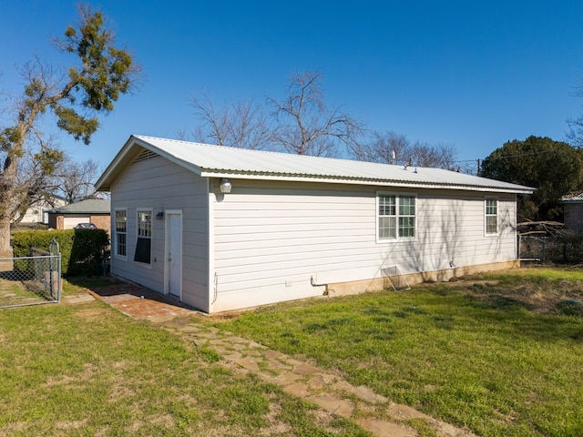 view of home's exterior with a lawn