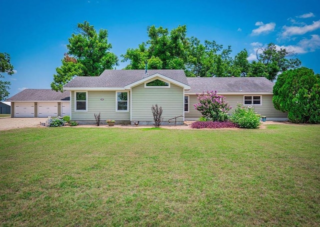 ranch-style home featuring a garage and a front yard