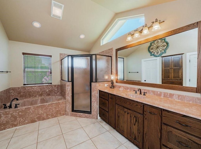 bathroom with plus walk in shower, tile patterned floors, lofted ceiling, and vanity