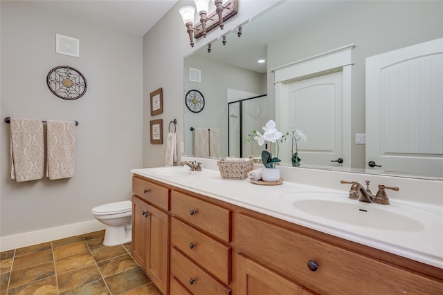 bathroom with toilet, an enclosed shower, and vanity