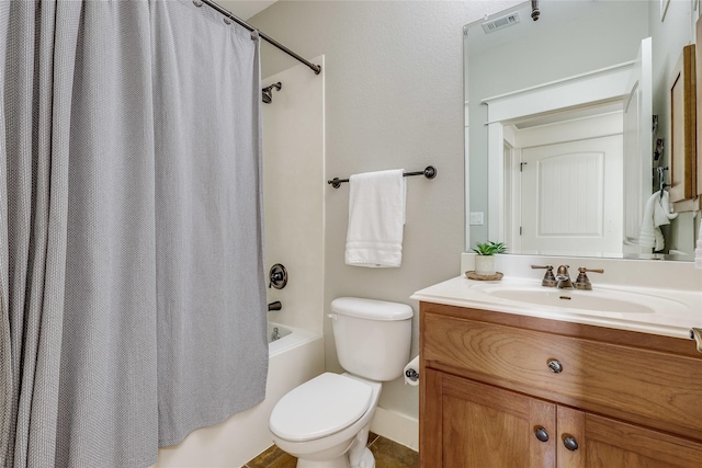 full bathroom featuring toilet, vanity, and shower / bath combination with curtain