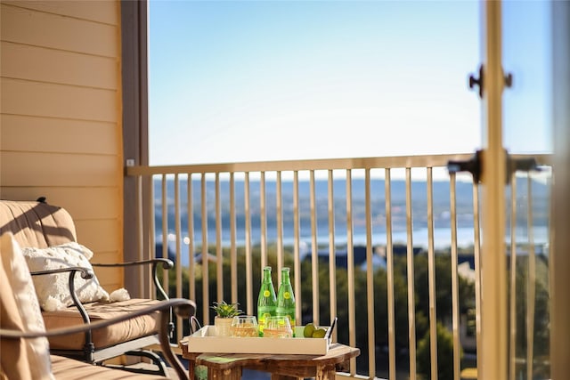 balcony featuring a water view