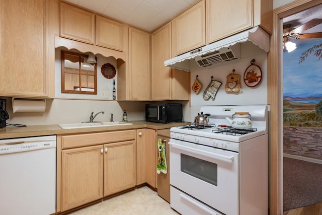 kitchen featuring sink, white appliances, and light brown cabinetry