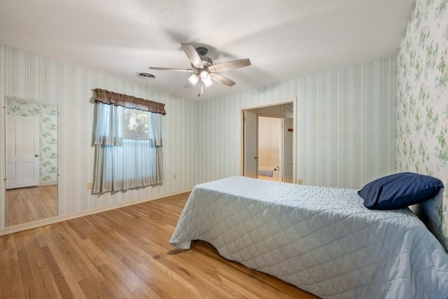 bedroom featuring wood-type flooring and ceiling fan