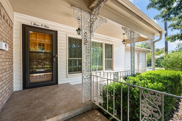 doorway to property featuring a porch