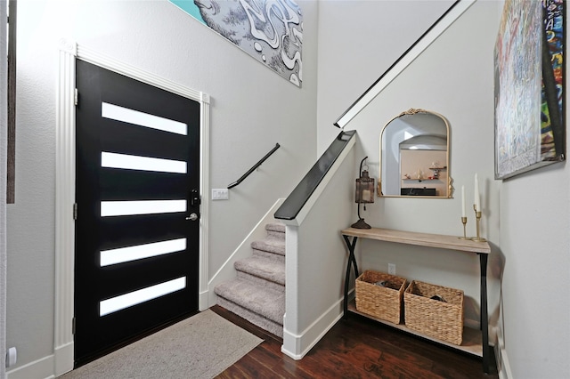 entrance foyer featuring dark hardwood / wood-style floors