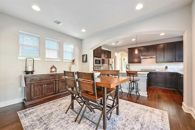 dining area with dark hardwood / wood-style flooring