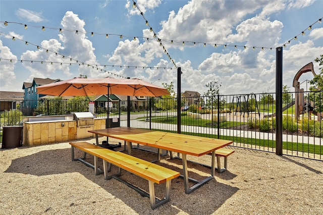 view of community featuring exterior kitchen