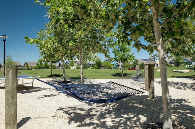 view of property's community featuring a lawn