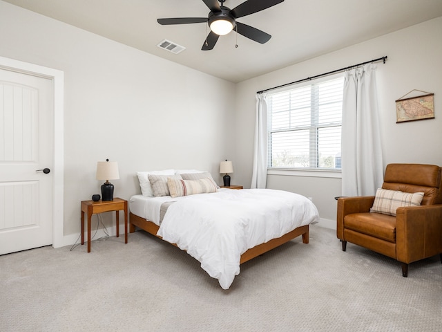 bedroom featuring light carpet and ceiling fan