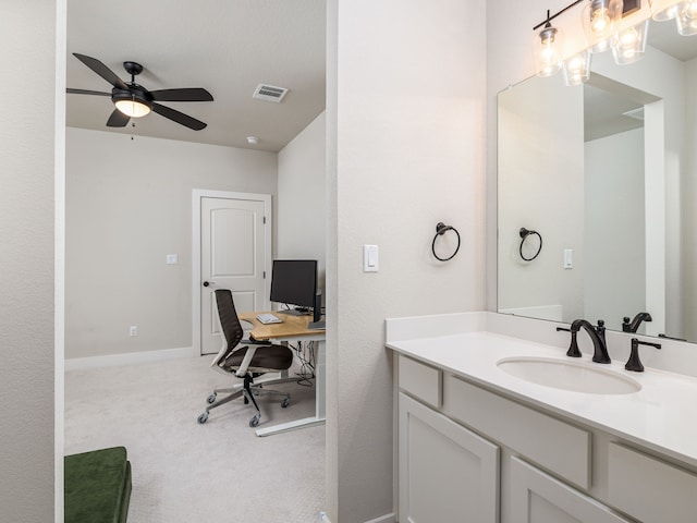 bathroom featuring ceiling fan and vanity