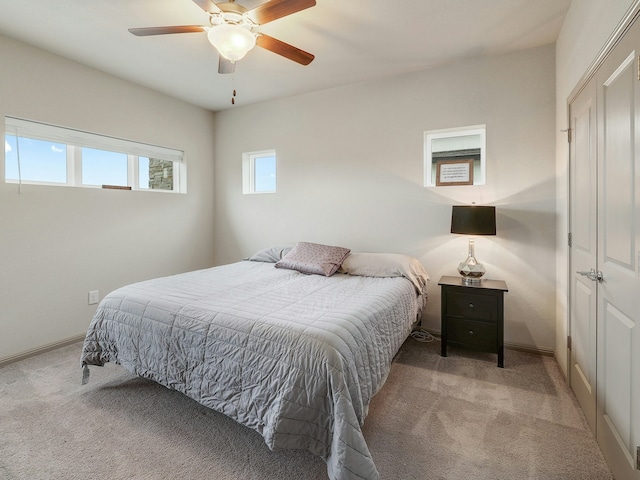 carpeted bedroom featuring ceiling fan