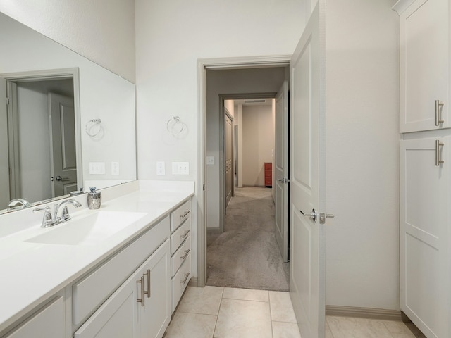 bathroom featuring tile patterned flooring and vanity