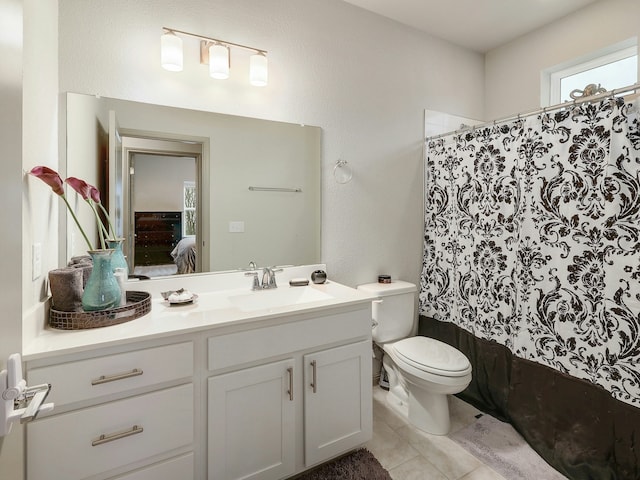 full bathroom with tile patterned floors, toilet, vanity, and shower / tub combo with curtain