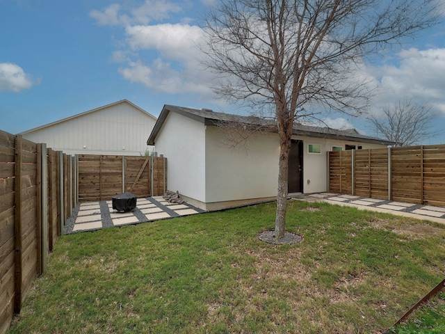 view of yard featuring an outdoor fire pit and a patio