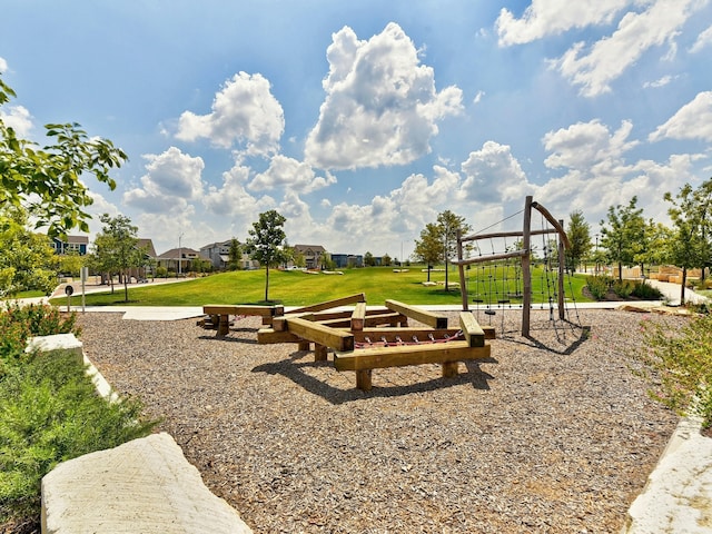 view of playground featuring a lawn