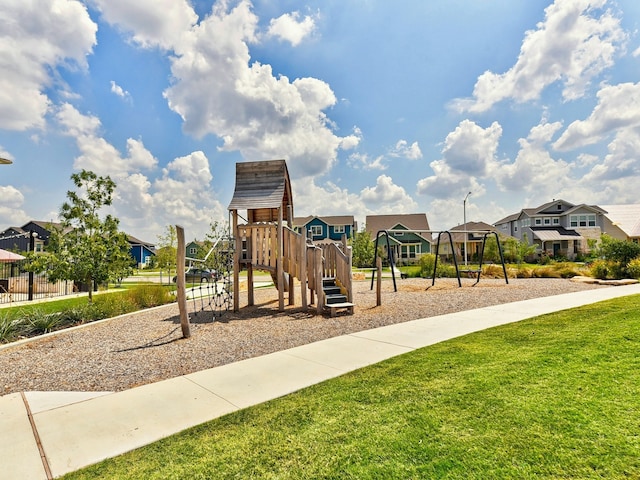 view of playground with a lawn