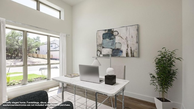 1716 Snowdrop Dr, Georgetown, TX 78628 - home office featuring plenty of natural light and dark wood-style flooring