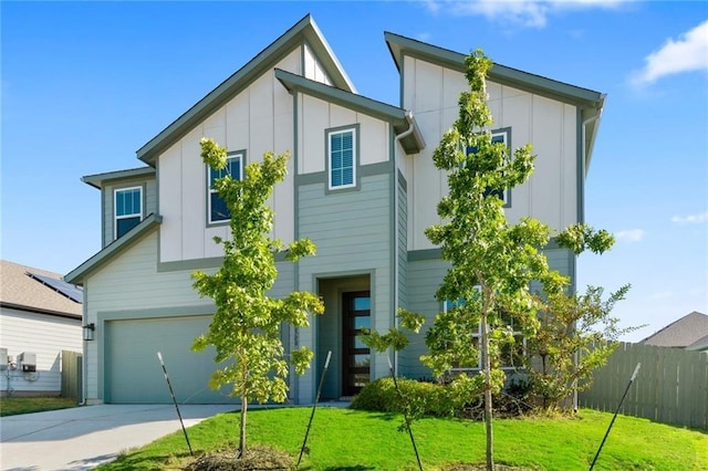 exterior space featuring a garage and a front lawn