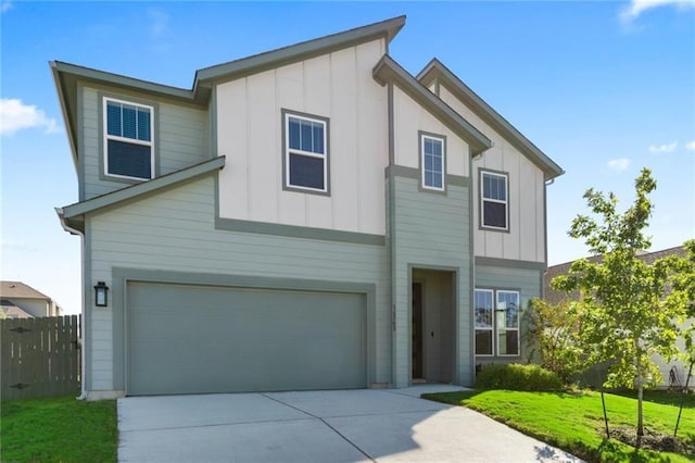 view of front facade featuring a garage and a front lawn