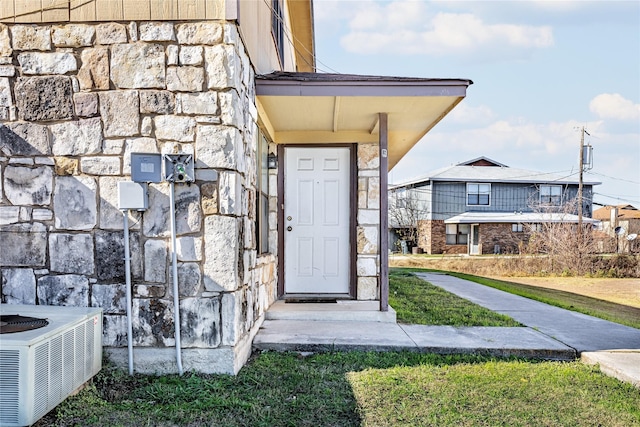 entrance to property featuring central AC unit