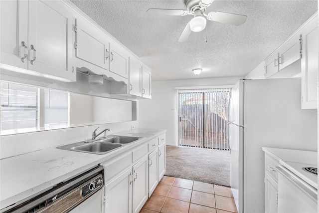 kitchen featuring light colored carpet, white appliances, white cabinets, and sink